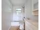 Clean bathroom with shower/tub and white tile at 2877 Michigan St, Sarasota, FL 34237