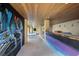 Covered patio features a bar with artistic mural and access to pool at 309 Ringling Point Dr, Sarasota, FL 34234