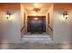 Impressive double front doors leading into a grand foyer at 309 Ringling Point Dr, Sarasota, FL 34234