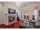 Living area with fireplace, seating area, and stunning sunset views at 309 Ringling Point Dr, Sarasota, FL 34234