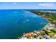 Beautiful aerial shot of coastal homes along the shore with docks and boats at 309 Ringling Point Dr, Sarasota, FL 34234