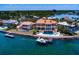 Expansive waterfront property featuring a main house, guest house, and private dock at 309 Ringling Point Dr, Sarasota, FL 34234