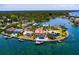 Breathtaking aerial view of luxurious waterfront home and lush landscape at 309 Ringling Point Dr, Sarasota, FL 34234