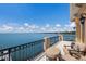 Private balcony with water views and comfortable seating at 309 Ringling Point Dr, Sarasota, FL 34234