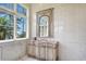 Bathroom with vanity, large mirror and water views at 309 Ringling Point Dr, Sarasota, FL 34234