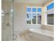 Luxurious bathroom with soaking tub and walk-in shower at 309 Ringling Point Dr, Sarasota, FL 34234