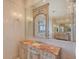 Bathroom with marble vanity, large mirror, and elegant fixtures at 309 Ringling Point Dr, Sarasota, FL 34234