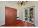 Guest bedroom with wood floors and a built-in Murphy bed at 309 Ringling Point Dr, Sarasota, FL 34234