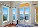 Bedroom with stunning water views and private balcony access at 309 Ringling Point Dr, Sarasota, FL 34234