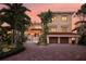 Stunning waterfront home with a two-car garage and manicured landscaping at 309 Ringling Point Dr, Sarasota, FL 34234