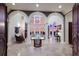 High-ceiling entryway with arched doorways and a view to the living room at 309 Ringling Point Dr, Sarasota, FL 34234