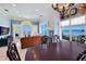 Elegant dining room with water views and a large chandelier at 309 Ringling Point Dr, Sarasota, FL 34234