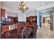 Spacious dining area with dark wood table and chairs at 309 Ringling Point Dr, Sarasota, FL 34234