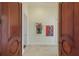 Elegant entry hall with hardwood floors, decorative niche, and rich wood doors at 309 Ringling Point Dr, Sarasota, FL 34234