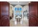 Two-story entry with double doors opening to a grand living room at 309 Ringling Point Dr, Sarasota, FL 34234