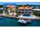 Stunning waterfront home boasts private dock, pool, and Mediterranean architecture at 309 Ringling Point Dr, Sarasota, FL 34234