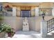 Elegant front entrance featuring a statue, stone accents, and manicured flower beds at 309 Ringling Point Dr, Sarasota, FL 34234