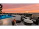 Luxury pool area with seating and sunset view at 309 Ringling Point Dr, Sarasota, FL 34234