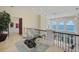 Stunning hallway with glass-top table and water views at 309 Ringling Point Dr, Sarasota, FL 34234