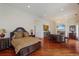 Large main bedroom with sitting area, fireplace and hardwood floors at 309 Ringling Point Dr, Sarasota, FL 34234