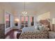 Primary bedroom with sunset view and seashell bedding at 309 Ringling Point Dr, Sarasota, FL 34234