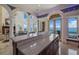 Island kitchen with granite countertops and wooden cabinetry at 309 Ringling Point Dr, Sarasota, FL 34234