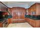 Kitchen with stainless steel appliances and dark wood cabinetry at 309 Ringling Point Dr, Sarasota, FL 34234