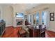 Spacious living room with hardwood floors, fireplace, and waterfront view at 309 Ringling Point Dr, Sarasota, FL 34234