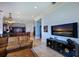 Open living area showcasing a kitchen and a large TV at 309 Ringling Point Dr, Sarasota, FL 34234