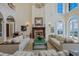 Spacious living area with fireplace and stunning water views at 309 Ringling Point Dr, Sarasota, FL 34234