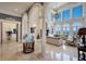 Bright living room with arched windows and ocean views at 309 Ringling Point Dr, Sarasota, FL 34234