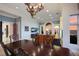 Elegant dining room with dark wood table, seating for six, and sunset views at 309 Ringling Point Dr, Sarasota, FL 34234