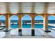 Hot tub and pool with covered patio offering amazing water views at 309 Ringling Point Dr, Sarasota, FL 34234