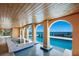 Hot tub and pool with covered patio and breathtaking water views at 309 Ringling Point Dr, Sarasota, FL 34234