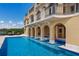 Beautiful luxury home showcasing a stunning pool with architectural details and lounge area at 309 Ringling Point Dr, Sarasota, FL 34234