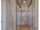 Large walk-in shower with marble walls and glass enclosure at 309 Ringling Point Dr, Sarasota, FL 34234