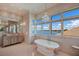 Bathroom with large soaking tub and water views at 309 Ringling Point Dr, Sarasota, FL 34234