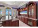 Upscale wet bar with wine cooler and built-in entertainment at 309 Ringling Point Dr, Sarasota, FL 34234