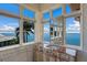 Vanity with marble countertop and multiple windows offering water views at 309 Ringling Point Dr, Sarasota, FL 34234