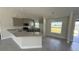 Well-lit kitchen featuring stainless appliances, granite counters, and ample storage space in a home setting at 3249 Vickers Ln, North Port, FL 34286