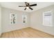 Well-lit bedroom with ceiling fan and hardwood floors at 3535 16Th N St, St Petersburg, FL 33704