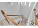 Modern staircase with wood railings and light-toned flooring at 3719 Scrub Creek Run, Bradenton, FL 34211