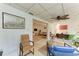 Sunroom with ceiling fan, wicker furniture, and view of the living area at 4718 Crystal Ave, Sarasota, FL 34231