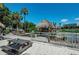 Waterfront area with thatched-roof structure, picnic tables, and boat launch at 4718 Crystal Ave, Sarasota, FL 34231