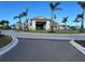 Community clubhouse with palm trees and landscaping at 4734 Tortona Ct, Bradenton, FL 34211