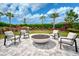 Relaxing fire pit with comfortable seating area and landscaping at 4734 Tortona Ct, Bradenton, FL 34211