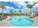 Community pool with cabana and surrounding landscaping at 4734 Tortona Ct, Bradenton, FL 34211