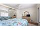 Spacious bedroom with mirrored closet, ceiling fan and tiled floors at 475 Benjamin Franklin Dr # 202, Sarasota, FL 34236