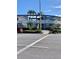 The Dorset: Building exterior showcasing its mid-century modern design and landscaping at 475 Benjamin Franklin Dr # 202, Sarasota, FL 34236
