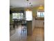 Island kitchen with granite countertops and white cabinetry at 475 Benjamin Franklin Dr # 202, Sarasota, FL 34236